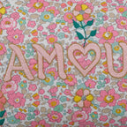 Coussin lombaire brodé rose clair Amour