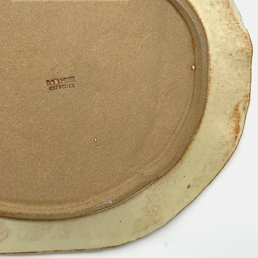 Plat de service arrondi en naturel